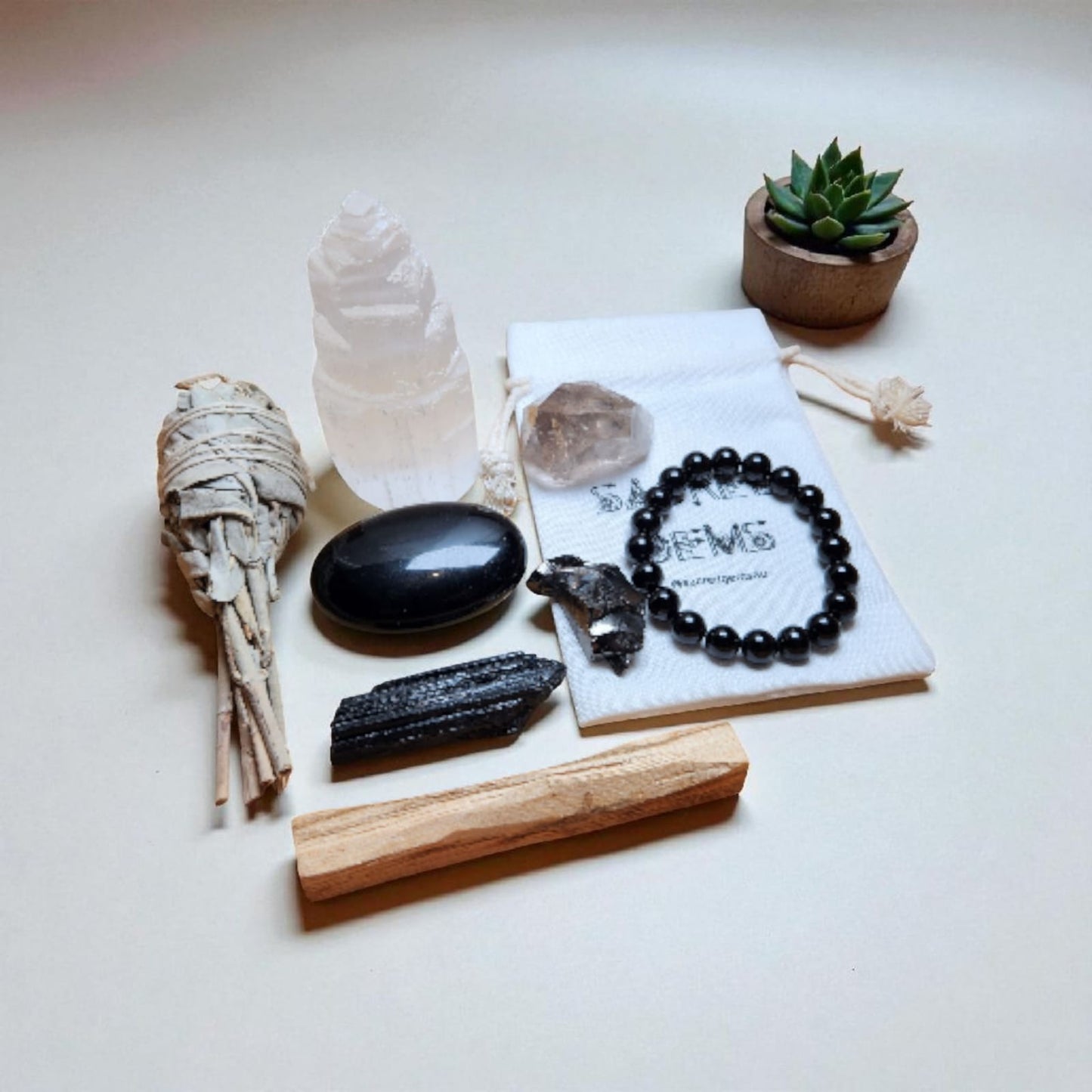 Sacred Gems – Protection Crystal Kit – Deluxe Edition full contents flat lay with Black Tourmaline bracelet and Elite Shungite [variant:deluxe]

