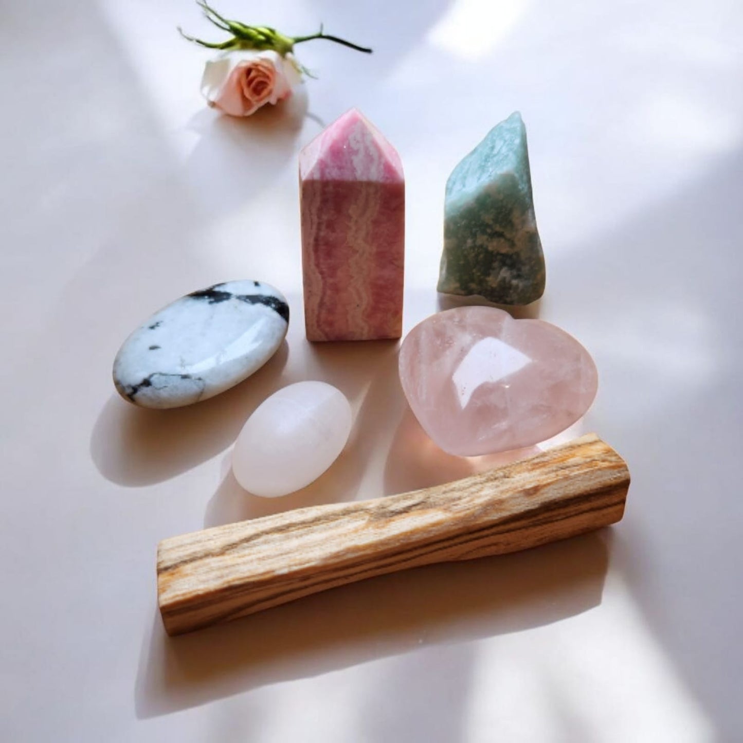 Sacred Gems – Love Crystal Kit – Standard Edition crystals (Rose Quartz,Mangano Calcite, Rhodonite, Green Aventurine, Moonstone) arranged on soft blush fabric [variant:standard]
