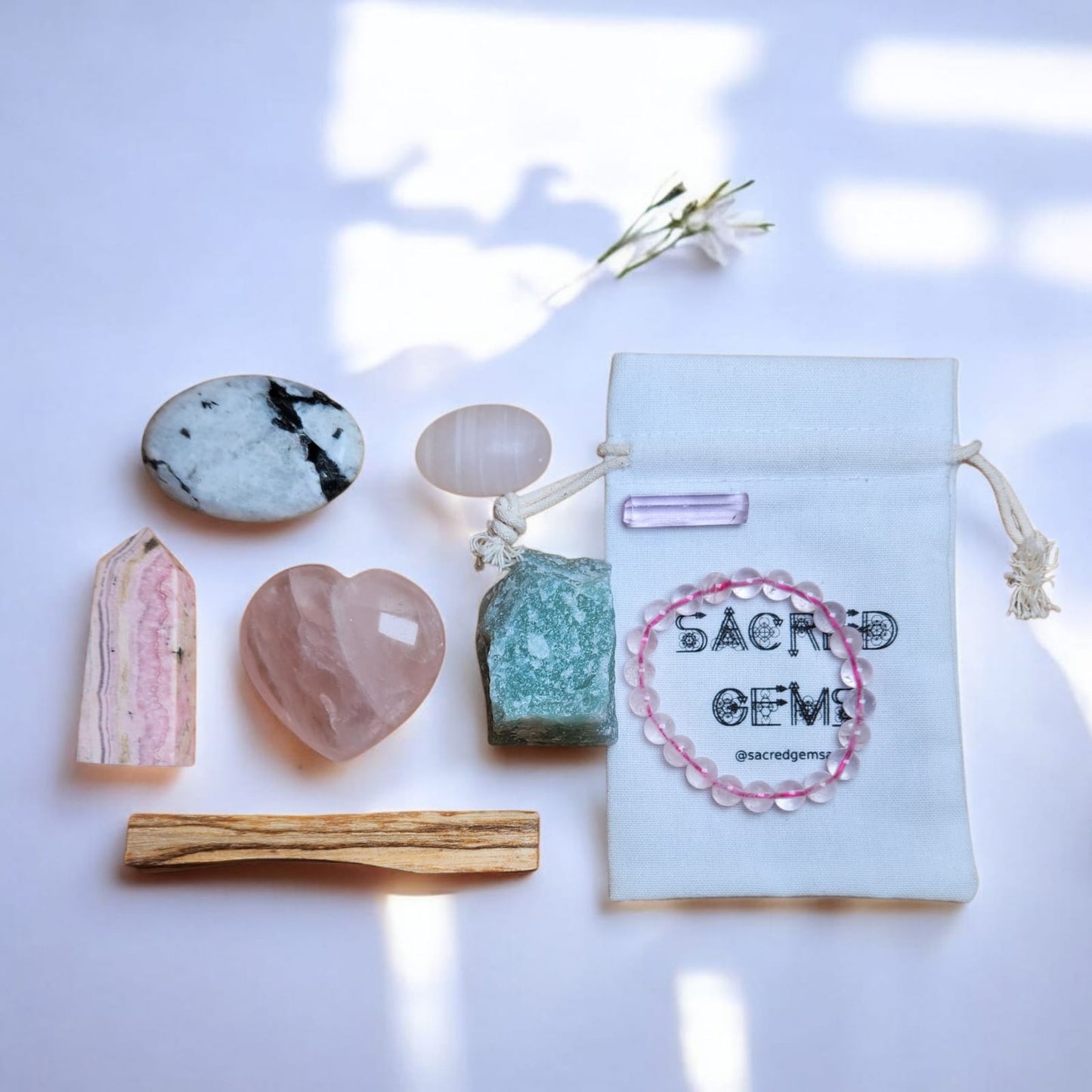 Sacred Gems – Love Crystal Kit – Deluxe Edition full contents flat lay including Kunzite and Rose Quartz bracelet [variant:deluxe]
