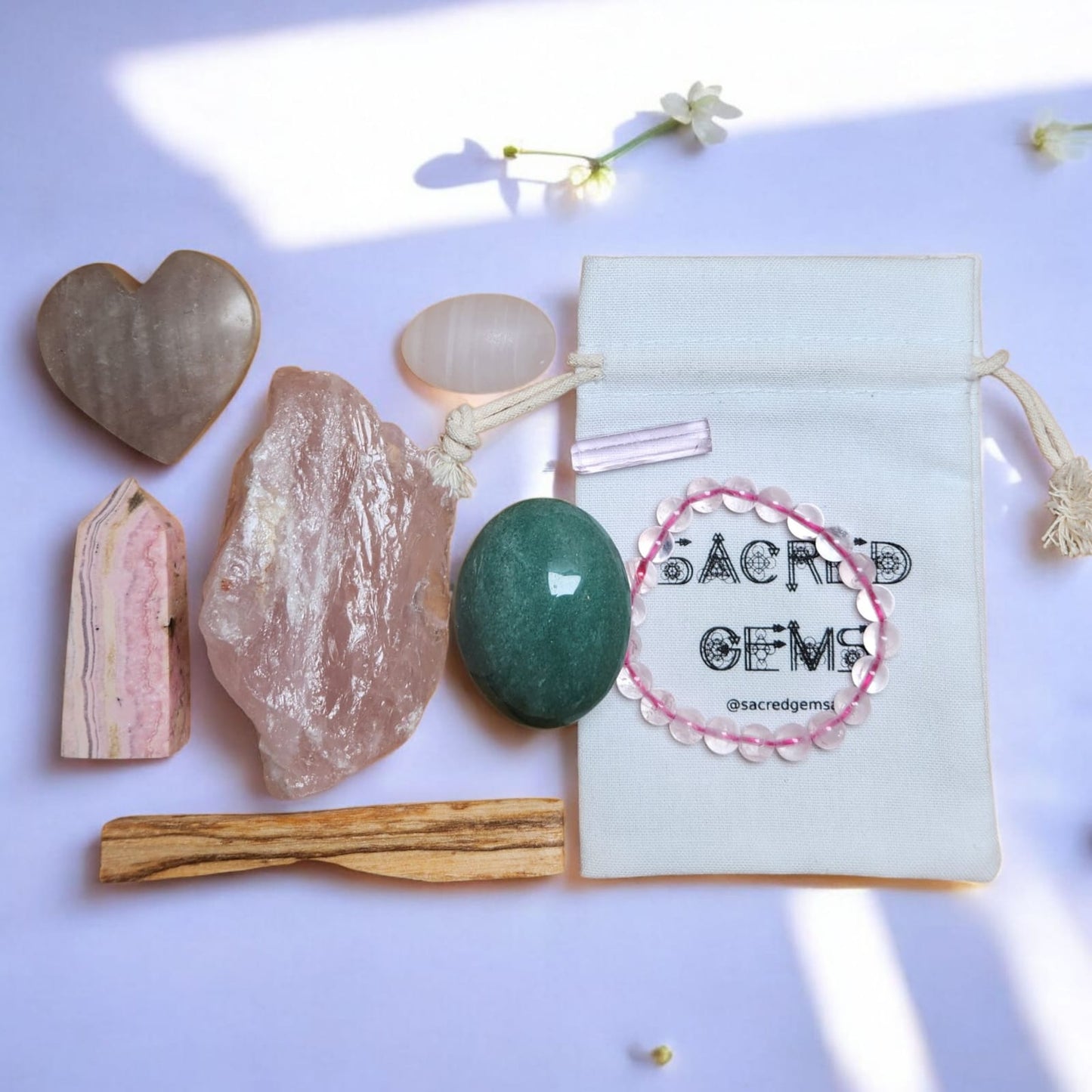 Sacred Gems – Love Crystal Kit – Deluxe Edition full contents flat lay including Kunzite and Rose Quartz bracelet [variant:deluxe]
